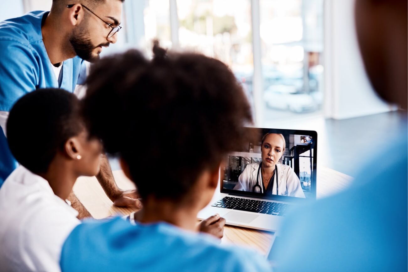 People around a computer screen